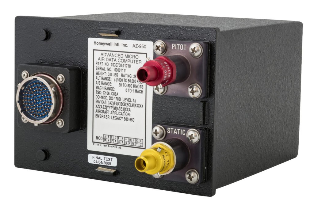 Black electronic unit with red and yellow connector caps