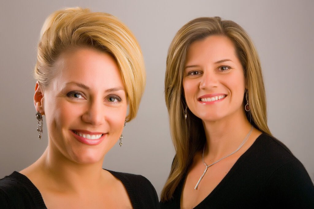 Two women in black tops photographed together