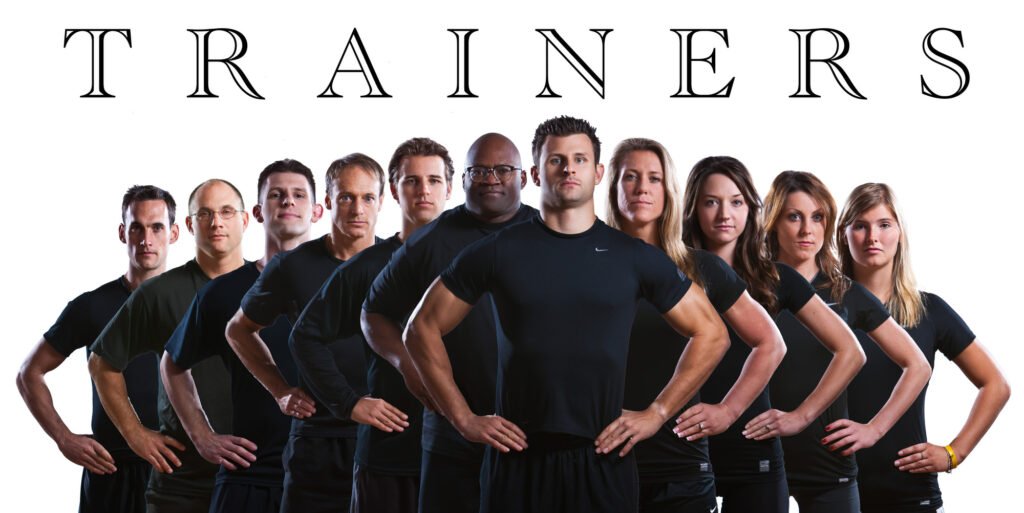 Fitness trainers standing together in black workout clothing
