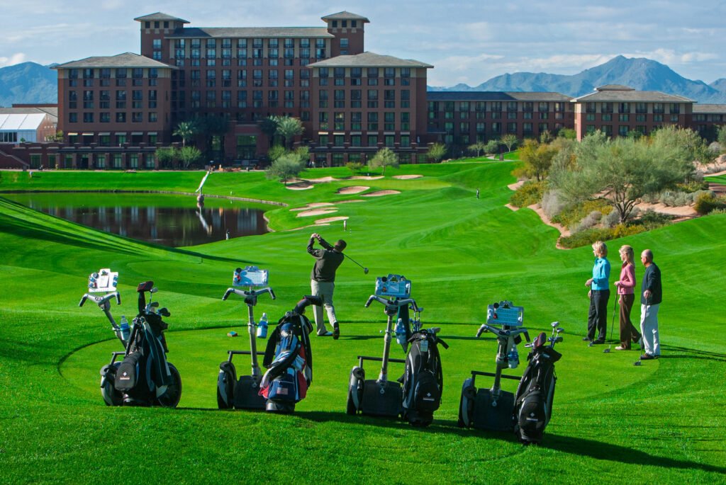 Golf equipment lined up on a resort putting green