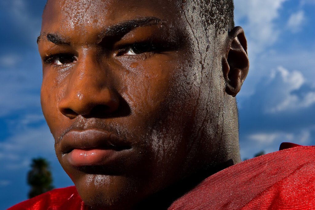Close-up portrait of a football player in a red jersey