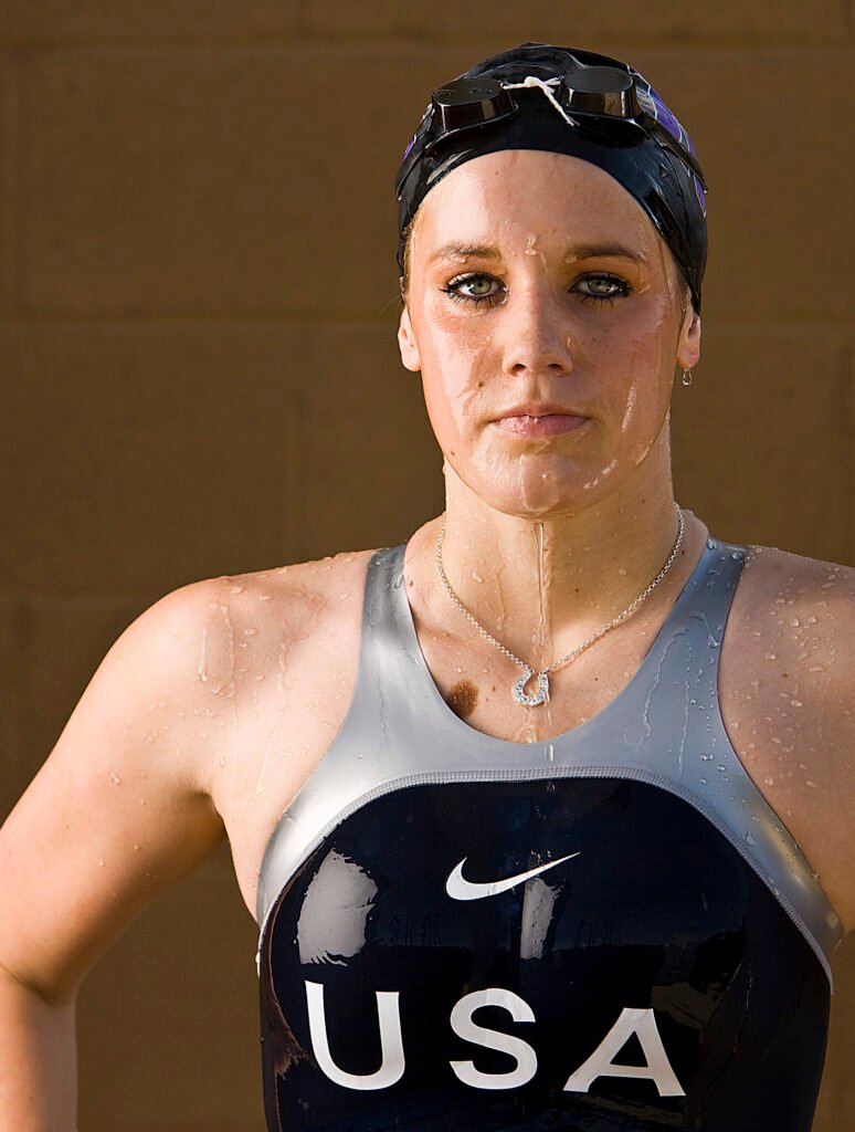 Portrait of a swimmer wearing a USA suit and goggles
